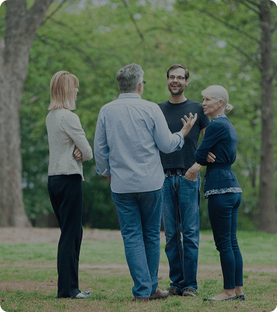 Group chatting outdoors in park