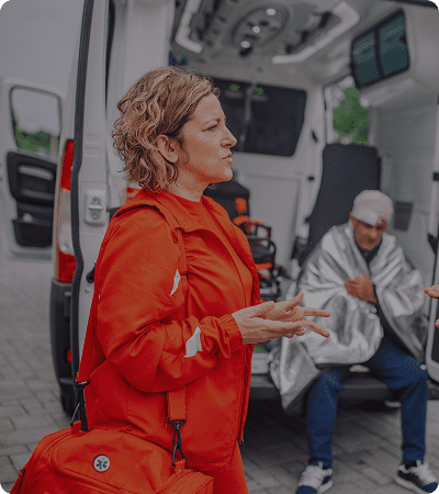 Paramedic talking outside ambulance