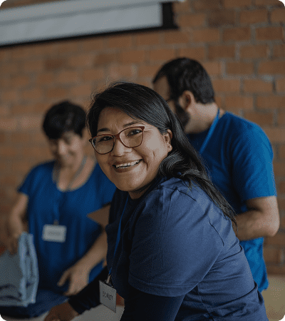 Happy volunteers wearing blue shirts