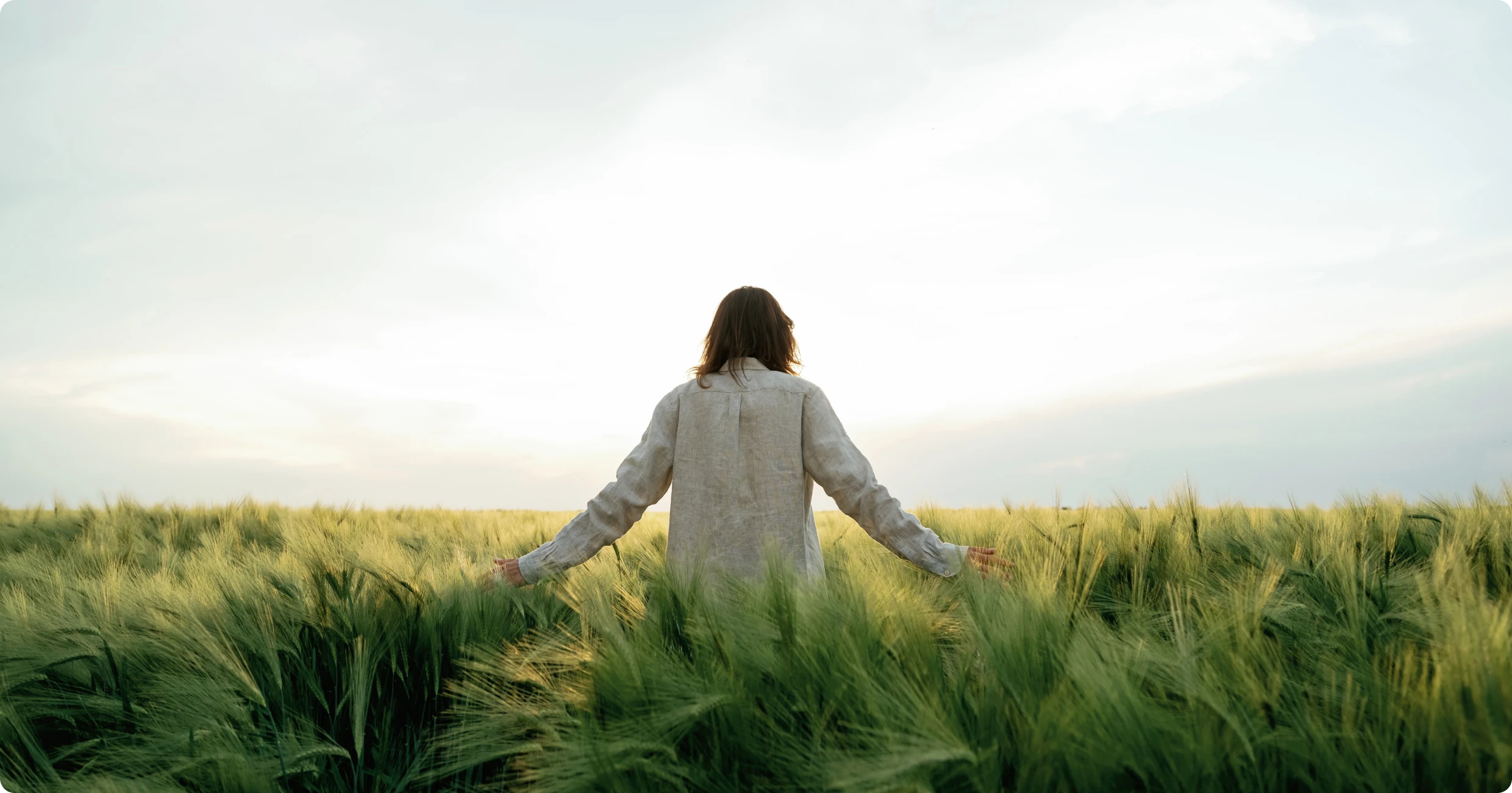 Individual enjoying nature in open landscape
